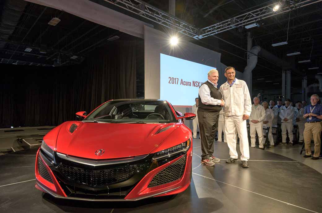 From left, Rick Hendrick, owner of Hendrick Motorsports and Hendrick Automotive Group, takes delivery of 2017 Acura NSX, VIN 001, from Acura NSX Engineering Large Project Leader Clement D'Souza.